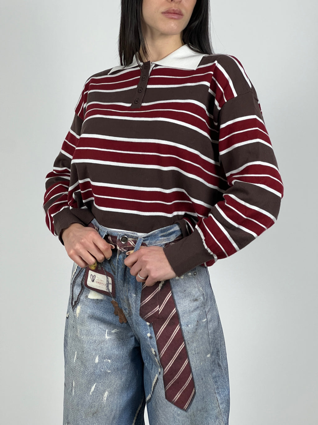 Polo manica lunga in filato a righe col. Marrone